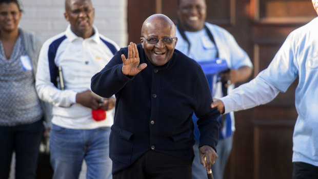 Anglican Archbishop Desmond Tutu exits his home after casting his special vote near Cape Town, South Africa.