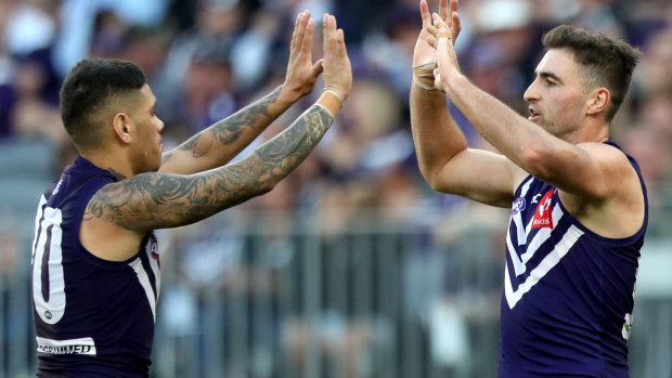 Michael Walters (left) with Shane Kersten before he injured his hamstring against Carlton.