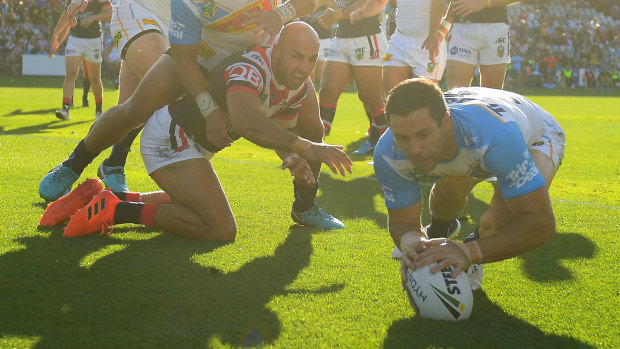 Michael Gordon of the Titans scores a try against former club Sydney Roosters.