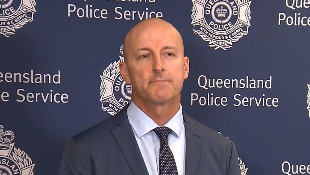Detective Inspector Chris Ahearn addresses the media over the death of a woman who had been restrained by residents at Tugun.
