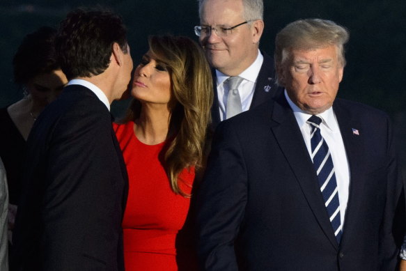 Canadian Prime Minister Justin Trudeau (left) greets Melania Trump as she arrives for a family photo with US President Donald Trump, during the G7 Summit in Biarritz, France in 2019.