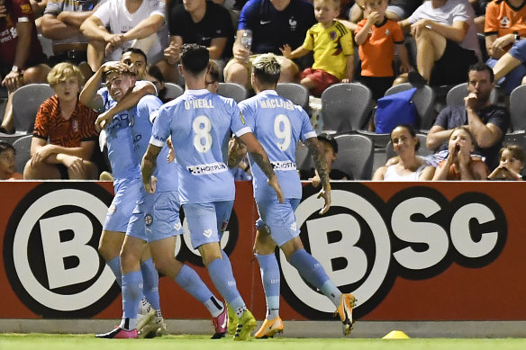 Metcalfe is mobbed by his Melbourne City teammates.
