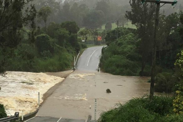 More than a dozen Queensland schools were closed on Tuesday after heavy rain flooded roads across the state.