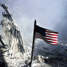 Am American flag flies near the base of the destroyed World Trade Center in New York, September 11, 2001.