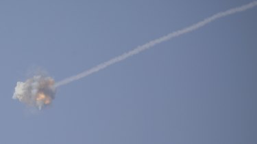 An Israeli Iron Dome air defense system missile is seen intercepting rockets fired from Gaza over Sderot, southern Israel.