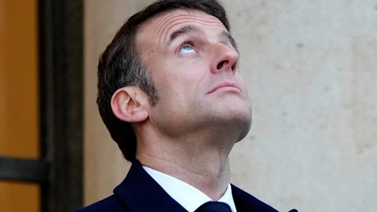 French President Emmanuel Macron waits for European heads of state at the Elysee Palace in Paris on Monday.