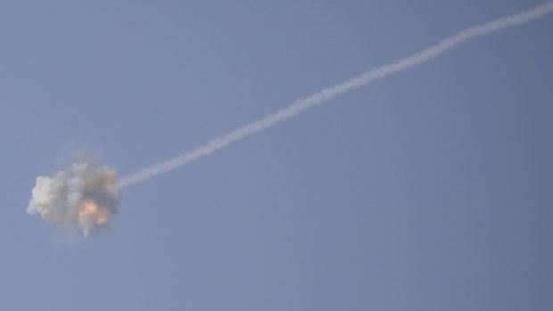 An Israeli Iron Dome air defense system missile is seen intercepting rockets fired from Gaza over Sderot, southern Israel.