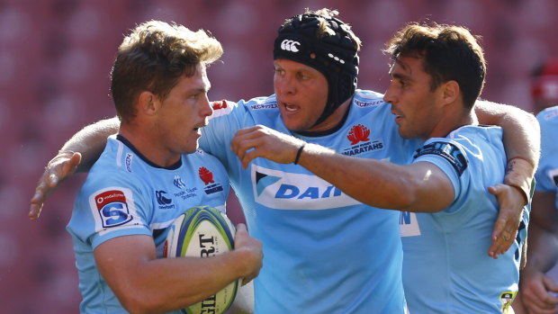 Digging in: the Waratahs celebrate captain Michael Hooper's try in South Africa.