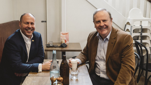 Josh Frydenberg (left) has enlisted Peter Costello, who ran surpluses for a decade, to take part in several promotional photo shoots at Melbourne coffee shops since becoming Treasurer.