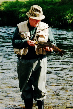 Ian Pullar with a trout caught on a fly.