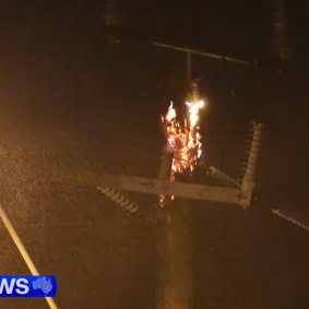 A Perth power pole on fire earlier this year.