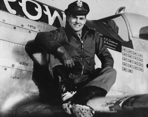 Captain Clarence E. Jr “Bud” Anderson, ace of the 357th Fighter Group, sits on the wing of his P-51 Mustang.
