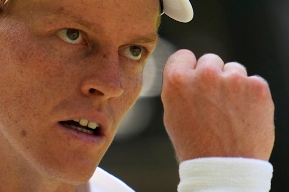 Jannik Sinner reacts after winning a point.