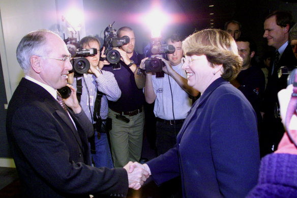 John Howard crosses paths with Australian Democrats leader, Meg Lees, after the agreement over the GST.