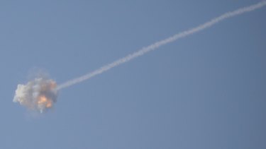 An Israeli Iron Dome air defense system missile is seen intercepting rockets fired from Gaza over Sderot, southern Israel.