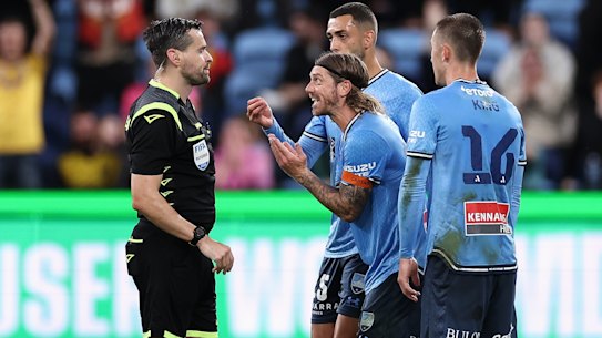 Luke Brattan pleads his case to the referee.