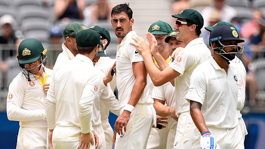 Fired up: Mitchell Starc looks back to Indian batsman Murali Vijay after he was dismissed for a duck on day two of the second Test match.