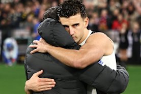 Collingwood coach Craig McRae and stand-in captain Nick Daicos embrace after their side was eliminated from this year’s finals series.