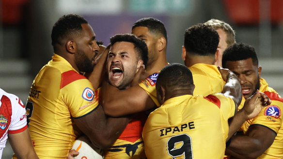 Papua New Guinea players celebrate during their game against Tonga at the World Cup. The rivalry is set to be rekindled in the Pacific Championships.