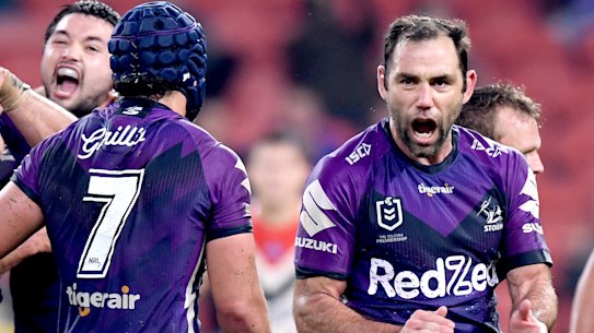 Cameron Smith celebrate the Storm's golden-point win against the Roosters in Brisbane on Thursday night.
