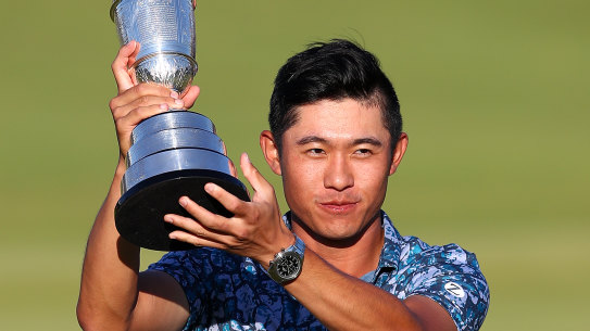 Open Champion Collin Morikawa raises the famous Claret Jug at Royal St George’s Golf Club on Sunday.