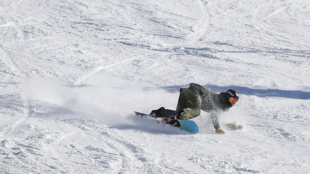 Kai Rennie, 13, getting low as he carves at Perisher.