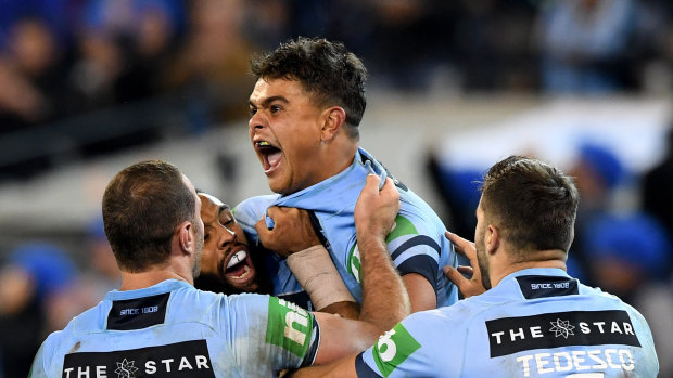 Centre of attention: Latrell Mitchell celebrates his try in Origin I.