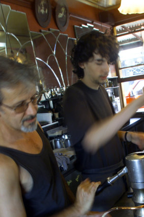 Sebes with his son, Danny, making coffee.