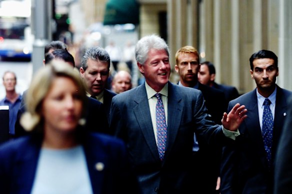 Another face in the crowd: Clinton in 2002.