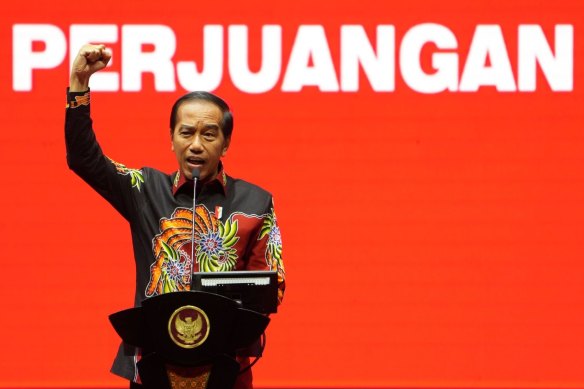 Indonesian President Joko Widodo, speaks during the Democratic Party of Struggle’s (PDI-P) 50th-year anniversary event in Jakarta, on Tuesday.  Behind him the word “struggle”.