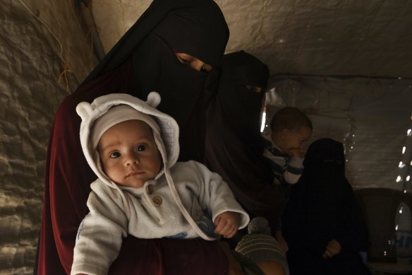 Kirsty Rosse-Emile, 25, holding her two-month-old son Yahya, the youngest Australian baby in al-Hawl camp in Syria in October. 