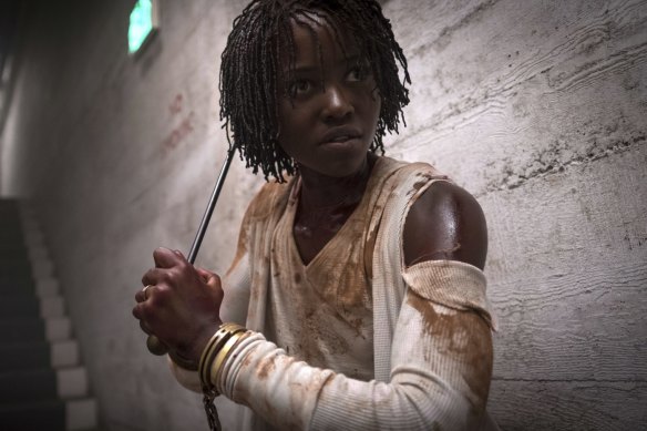 Lupita Nyong’o in a scene from Us, written, produced and directed by Jordan Peele.