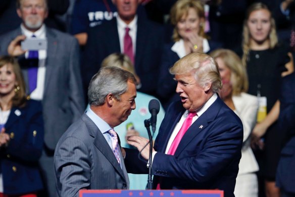 A meeting of like minds: Donald Trump welcomes Nigel Farage to the stage at a campaign rally in 2016.