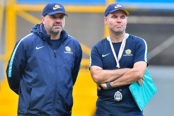 Ange Postecoglou and Ante Milicic watch the Socceroos train in Honduras in 2017.