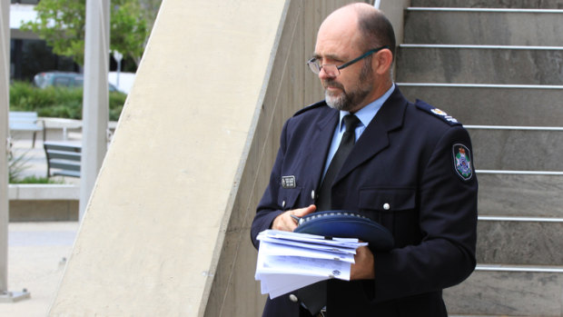 Police prosecutor Senior Sergeant David Clarke leaves the Beenleigh Magistrates Court after a man accused of snatching a sleeping girl from her bed in Loganlea appeared.