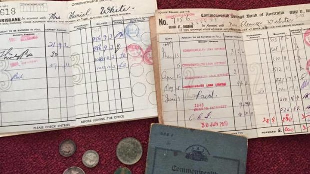 Coins and bank passbooks were found under the lino of a Brisbane home.