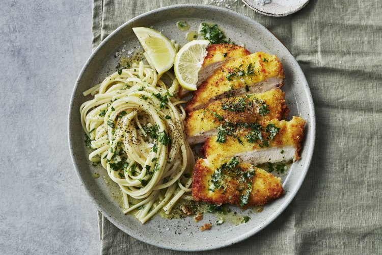 Crumbed chicken with herb and garlic butter pasta.