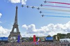 French Elite acrobatic team Patrouille de France flyes over the Eiffel Tower during the Olympic Games handover from Tokyo to Paris in 2021.
