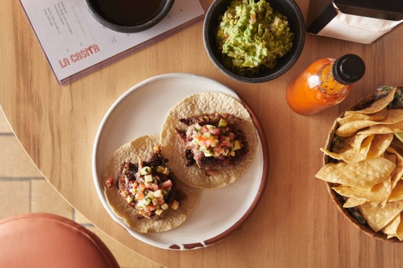 Slow-roasted lamb tacos with zucchini pico de gallo and salsa morita.