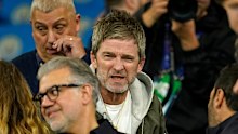Musician Noel Gallagher grimaces.