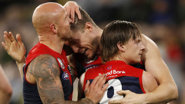 Nathan Jones celebrates a goal with Tom McDonald and Charlie Spargo earlier this season.