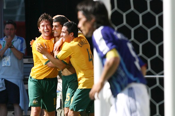 John Aloisi celebrates his goal with Harry Kewell and Tim Cahill. 