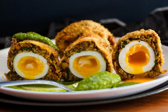 Vegetarian scotch eggs with vibrant green goddess dressing.