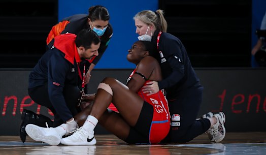 Sam Wallace grimaces in pain after injuring her knee on Saturday night.