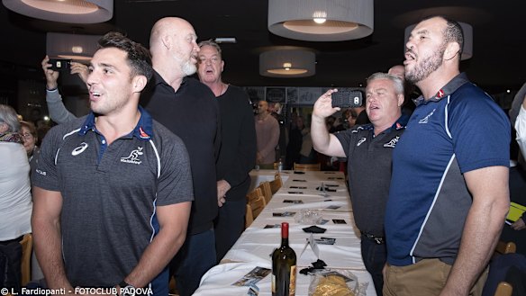 Song and dance: Cheika, Nick Phipps and the Wallabies contingent join in a rendition of Advance Australia Fair.