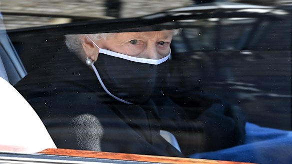 The Queen arrives for the funeral in the state Bentley. 
