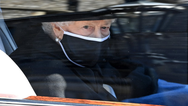The Queen arrives for the funeral in the state Bentley. 