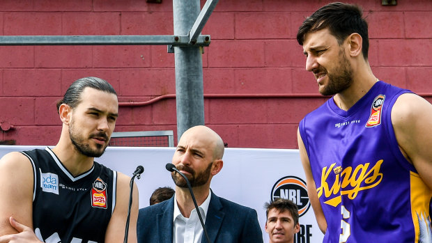 Melbourne United guard Chris Goulding (centre left) and Sydney Kings center Andrew Bogut (right) at the pre-season NBL jersey launch.