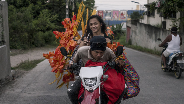 Contestant Angel Cabaluna is given a ride to an annual transgender beauty pageant in Maria Respondo, Philippines.
