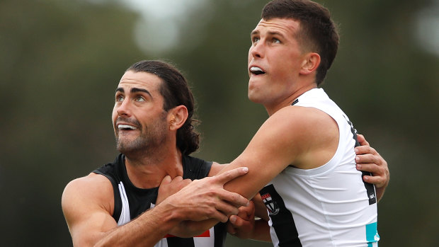 Eyes on the ball: Magpie Brodie Grundy takes on St Kilda's Rowan Marshall in the ruck.